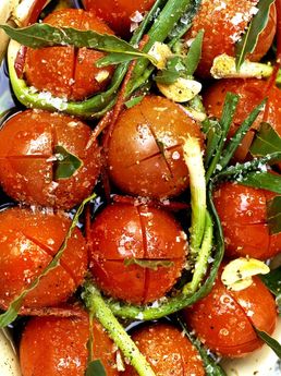 Slow-roasted balsamic tomatoes with baby leeks and basil