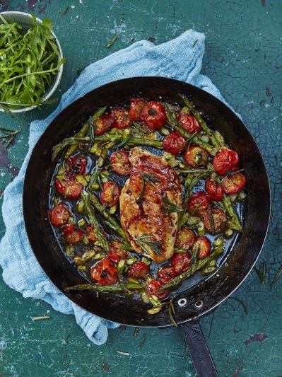Roasted chicken breast with cherry tomatoes and asparagus