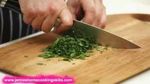 Chopping a bunch of fresh herbs: Jamie’s Food Team